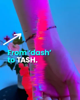 Blog cover From dash to TASH: a wrist with a small tattooed dash.